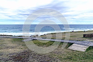 Wooden walkways to access Razo beach with view of the atlantic o