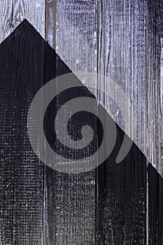 Wooden wall painted in black. Shabby wood texture. Old weathered boards. Natural background