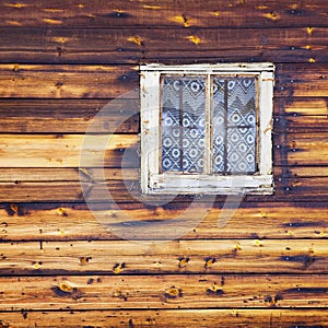 Wooden wall with square window