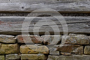 Wooden wall with a stone foundation photo