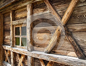 Wooden wall of a traditional alpine wood cabin