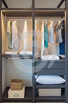 wooden wardrobe in walk in closet