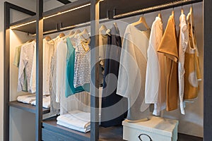 wooden wardrobe in walk in closet