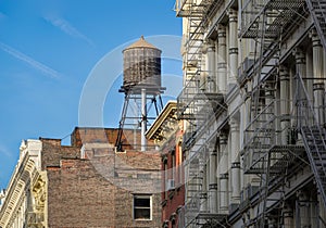 Wooden water tank and cast iron facades, Soho, New York photo