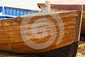 Wooden weathered old boat beached