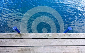 Wooden wharf and blue water