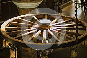 Wooden wheel converted into a chandelier