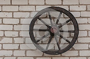 Wooden wheel on the wall