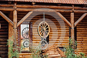 wooden wheels hanging on a rope near the wall