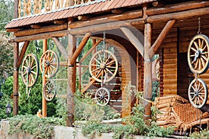 wooden wheels hanging on a rope near the wall