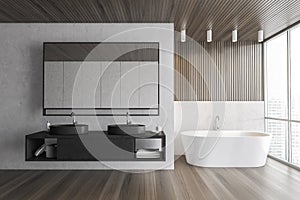 Wooden and white bathroom with bathtub and two sinks, parquet floor