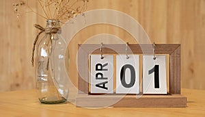 Wooden white brick calendar with the engraved date \