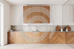 Wooden and white kitchen interior with cupboards and cabinets