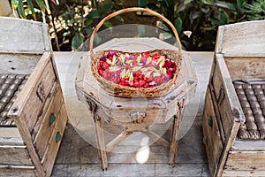 Wooden wicker basket with flowers for beauty spa