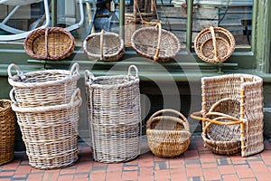 Wooden wicker baskets for sale in a street market fair. The concept of traditional culture