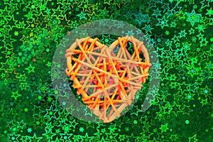 Wooden wicker heart. Rattan work in the shape of heart. Love concept. Background with selective focus. Holographic back