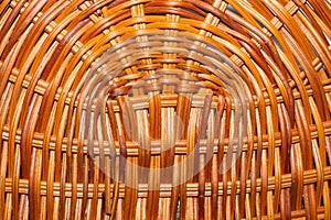 Wooden wicker straw background. woven surface of handcrafted basket