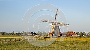 Wooden windmill on countryside