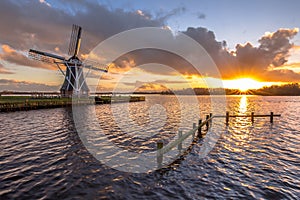 Wooden windmill on lakefront