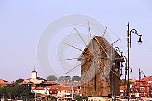 Wooden windmill and old town  Nessebar cityscape