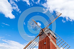 Wooden windmill under blue sky