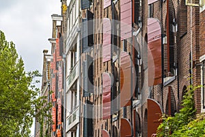 Wooden window blinds on typical Amsterdam houses
