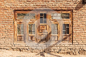 Wooden window in a brick house in a village in Jammu and Kashmir photo