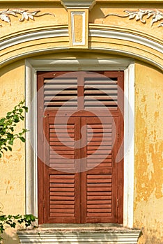 Wooden window of classic sino portuguese architecture in old town Phuket Thailand