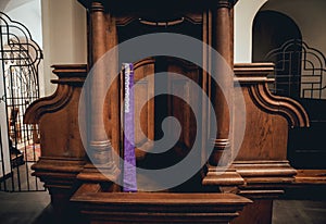 Wooden window of confessional box at church