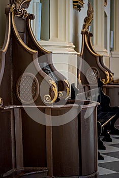 Wooden window of confessional box at church