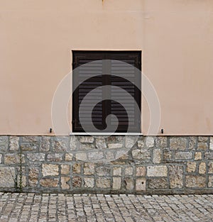 wooden window in the facade of old building