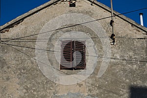 wooden window in the facade of old building