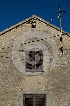 wooden window in the facade of old building