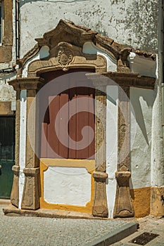 Wooden window on facade of old colorful house photo