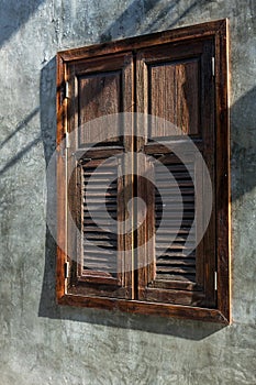 Wooden window isolated on  cement background. Window Close with the Cement wall have white color or color cement or plaster bare.