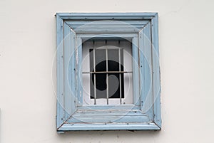 Wooden window with metal grill