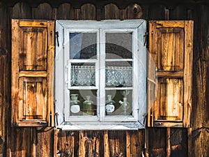 Wooden window of an old colorful house
