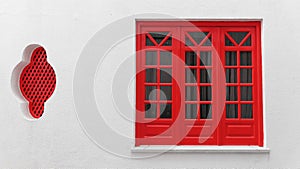 Wooden window with red frames