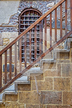 Wooden window and staircase with wooden balustrade leading to historic Beit El Set Waseela building, Old Cairo, Egypt photo