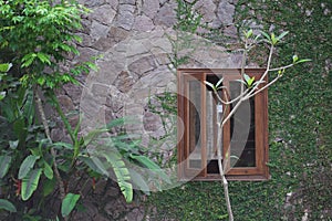 Wooden window in the stone wall