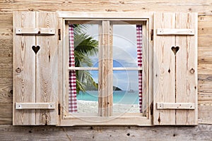 Wooden window with sunny beach panorama view