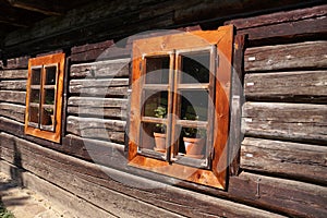 Wooden windows of an old house made of timber