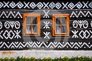 Wooden windows on wooden wall of wooden cottage