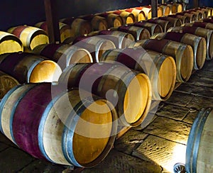 Wooden wine barrels in a basement