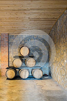 Wooden wine barrels in a old wine cellar