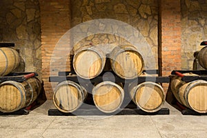 Wooden wine barrels in a old wine cellar