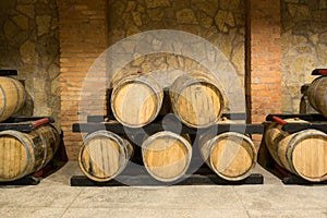 Wooden wine barrels in a old wine cellar