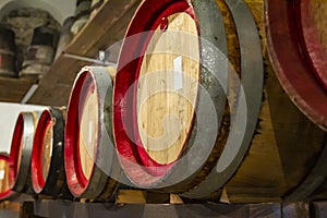 Wooden wine barrels in a very old basement