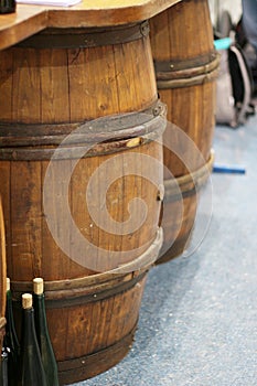 Wooden wine barrels for vineyards decorated with ivy leaves and bunches of grapes