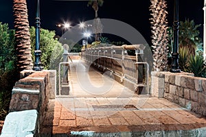 The wooden Wishing Bridge at night in old city Yafo, Israel.